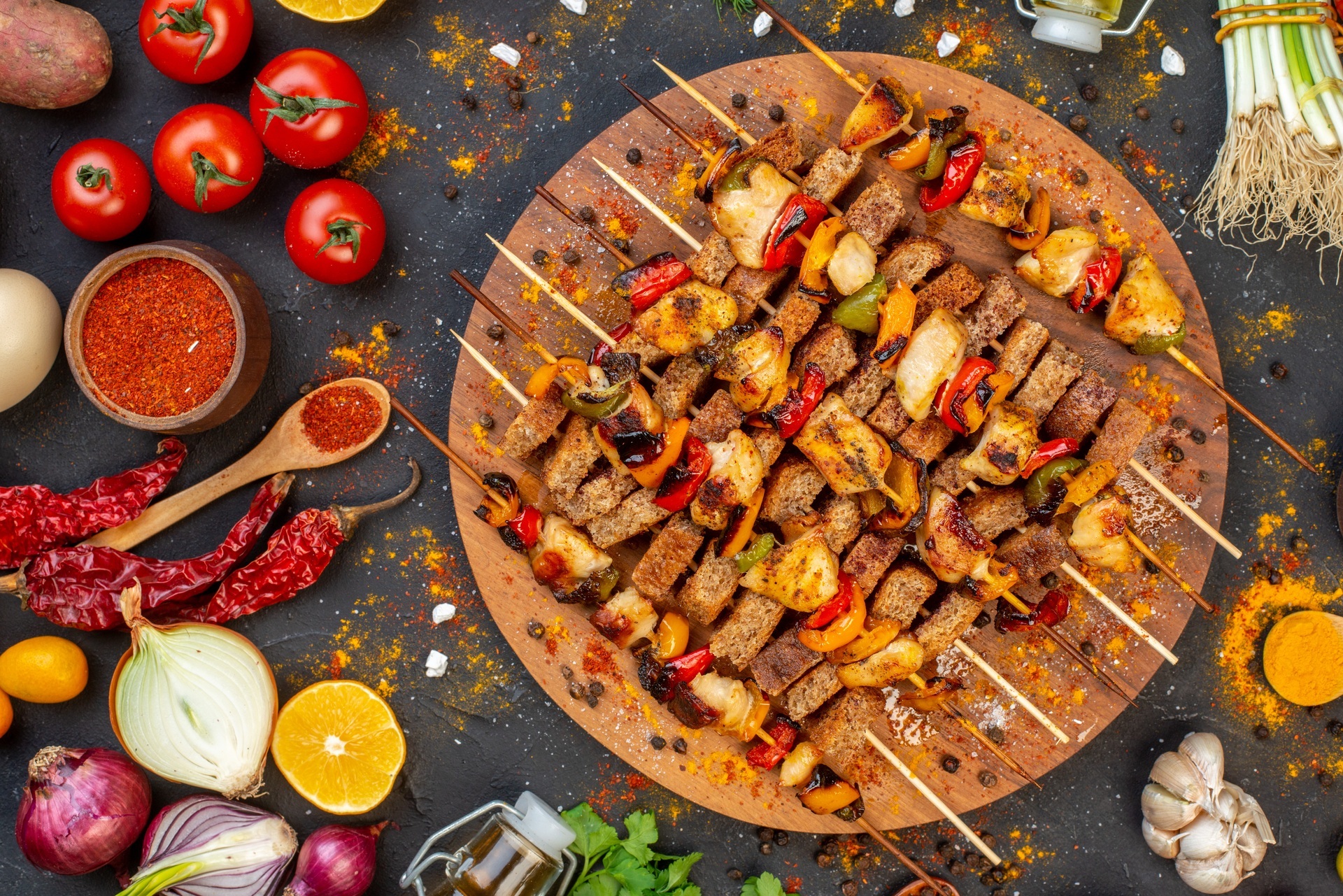 top-view-tasty-chicken-kebab-wooden-serving-board-other-stuffs-table